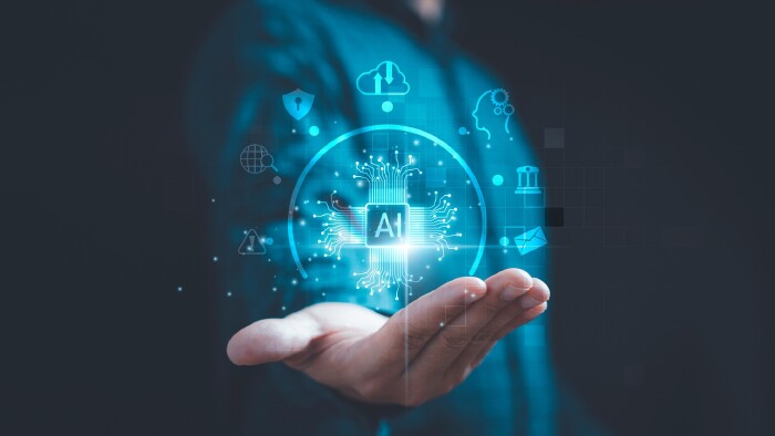 Gesch&auml;ftsmann mit KI-Symbolen f&uuml;r automatisierte Arbeitsprozesse